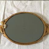 Golden oval mirror