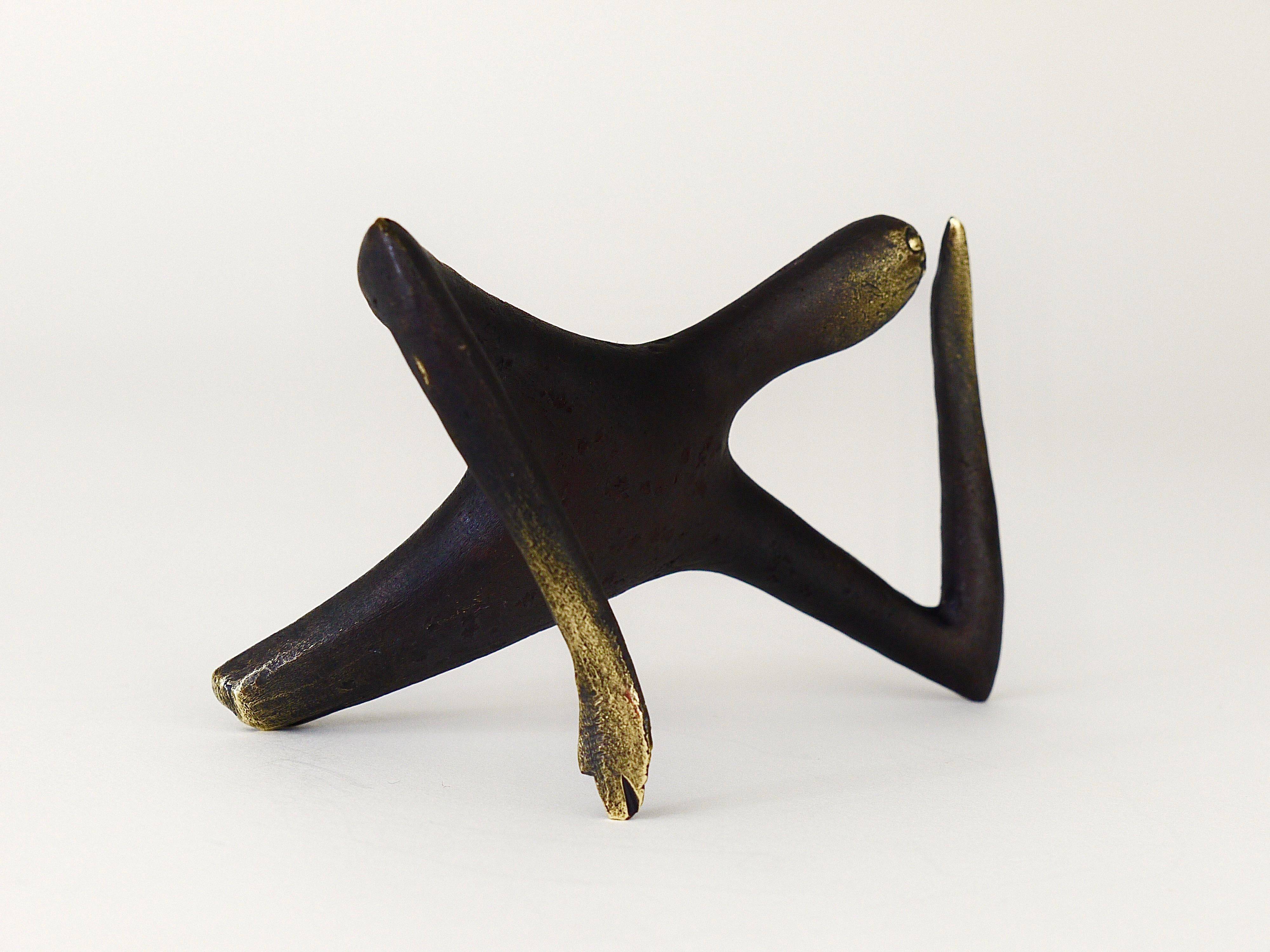 Handmade brass sculpture by Carl Auböck, Optimist Pessimist, model no. 4059.