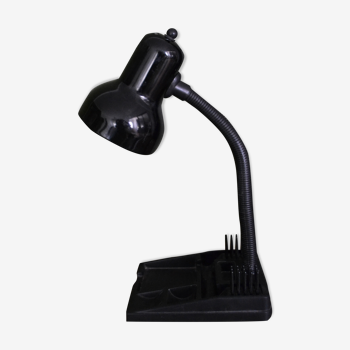 Black flexible desk lamp with built-in flashheld