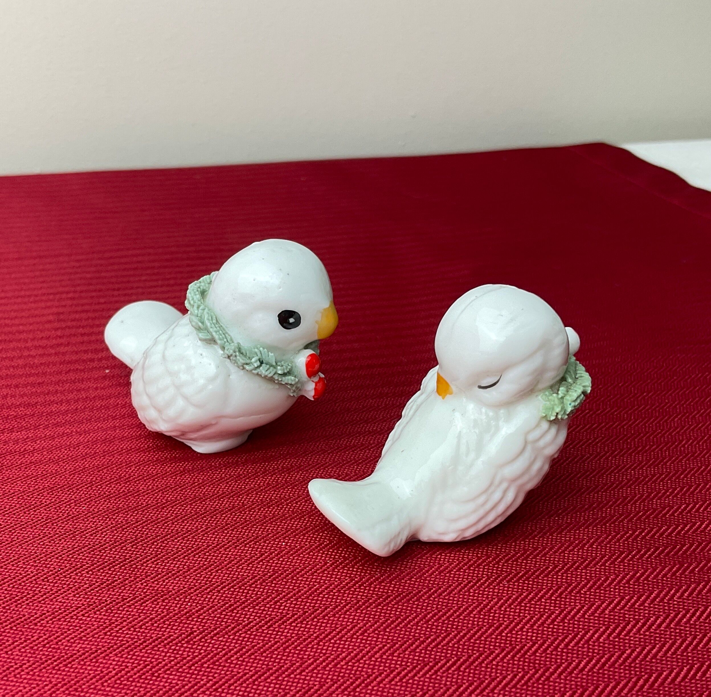 Pair of miniature white birds in ancient ceramics
