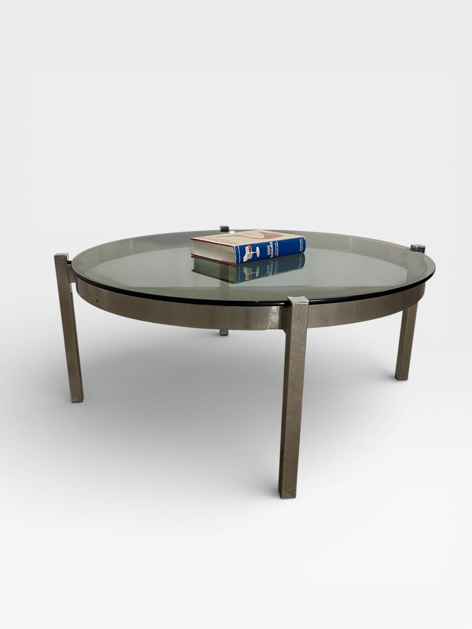 Vintage round coffee table with smoked glass and chrome.
