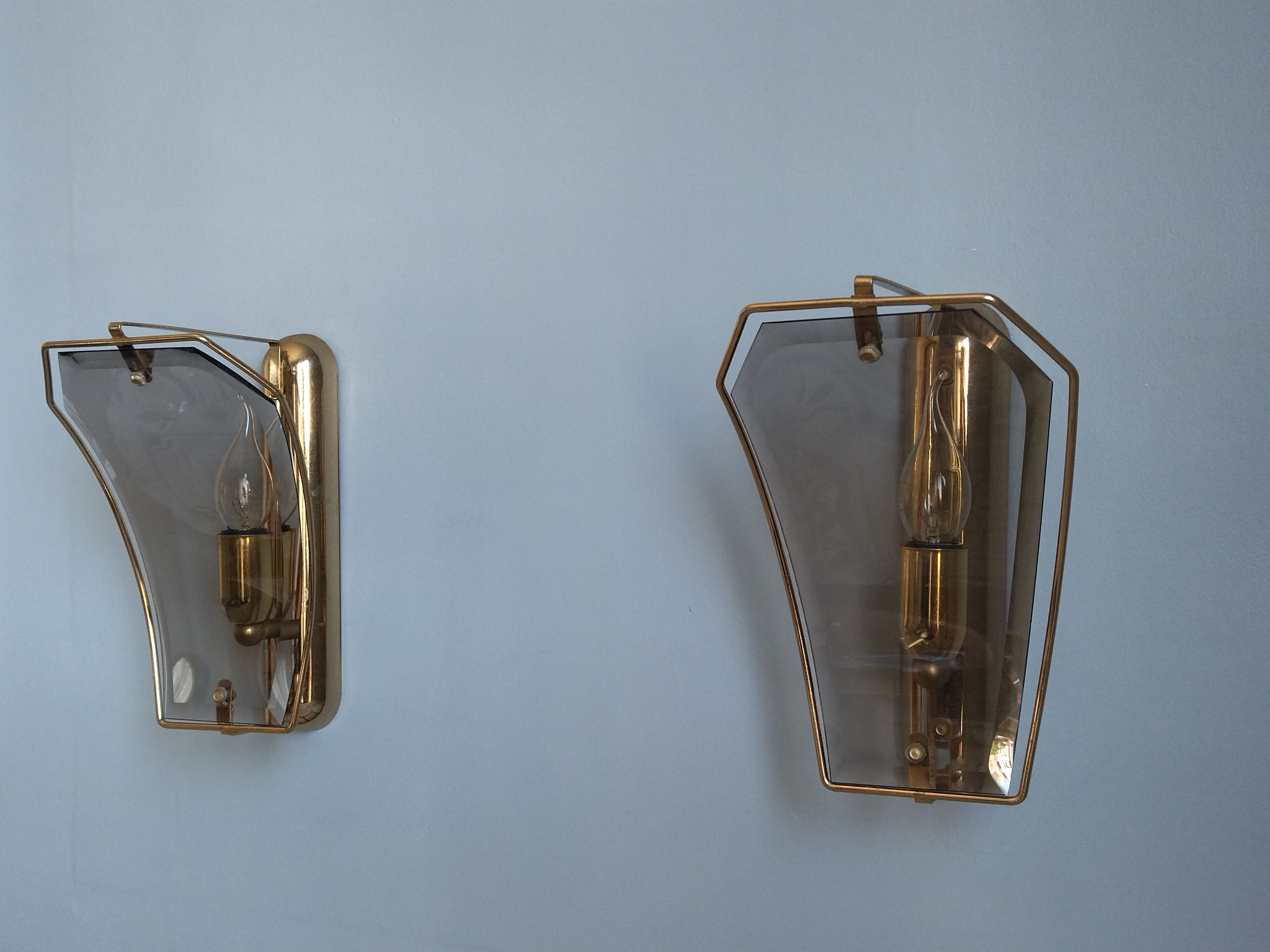 Pair of brass and curved glass wall lamps from the 80s