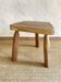 Brutalist tripod coffee table in solid olive ash wood