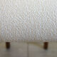Fauteuil vintage en bois et bouclette fine