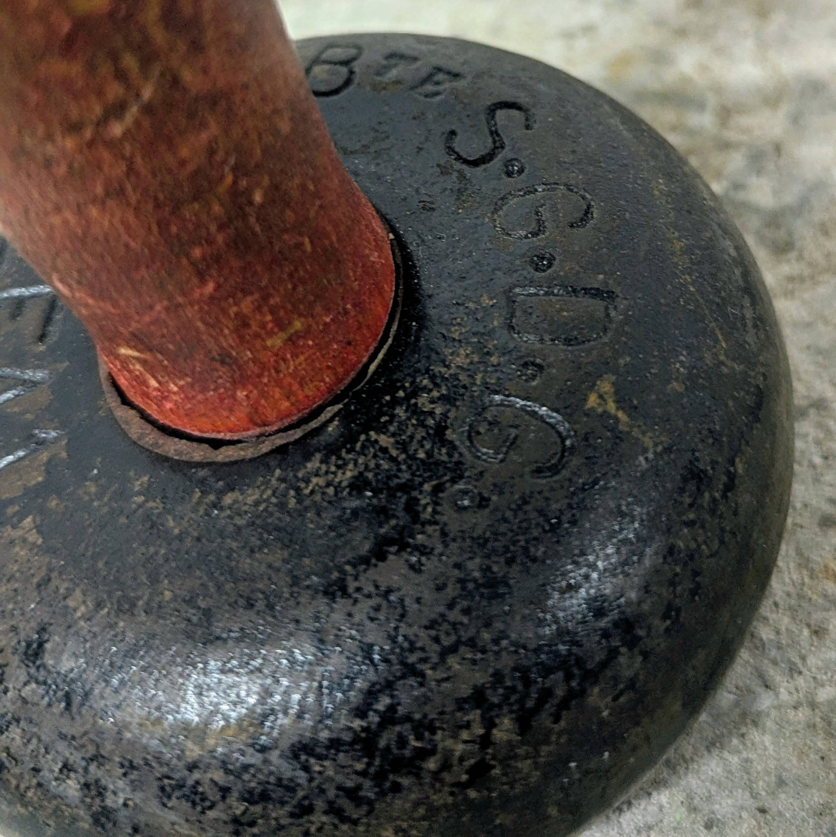 Pair of vintage cast iron and wood dumbbells