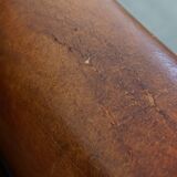 Sheepskin leather armchair in a cognac color with black piping