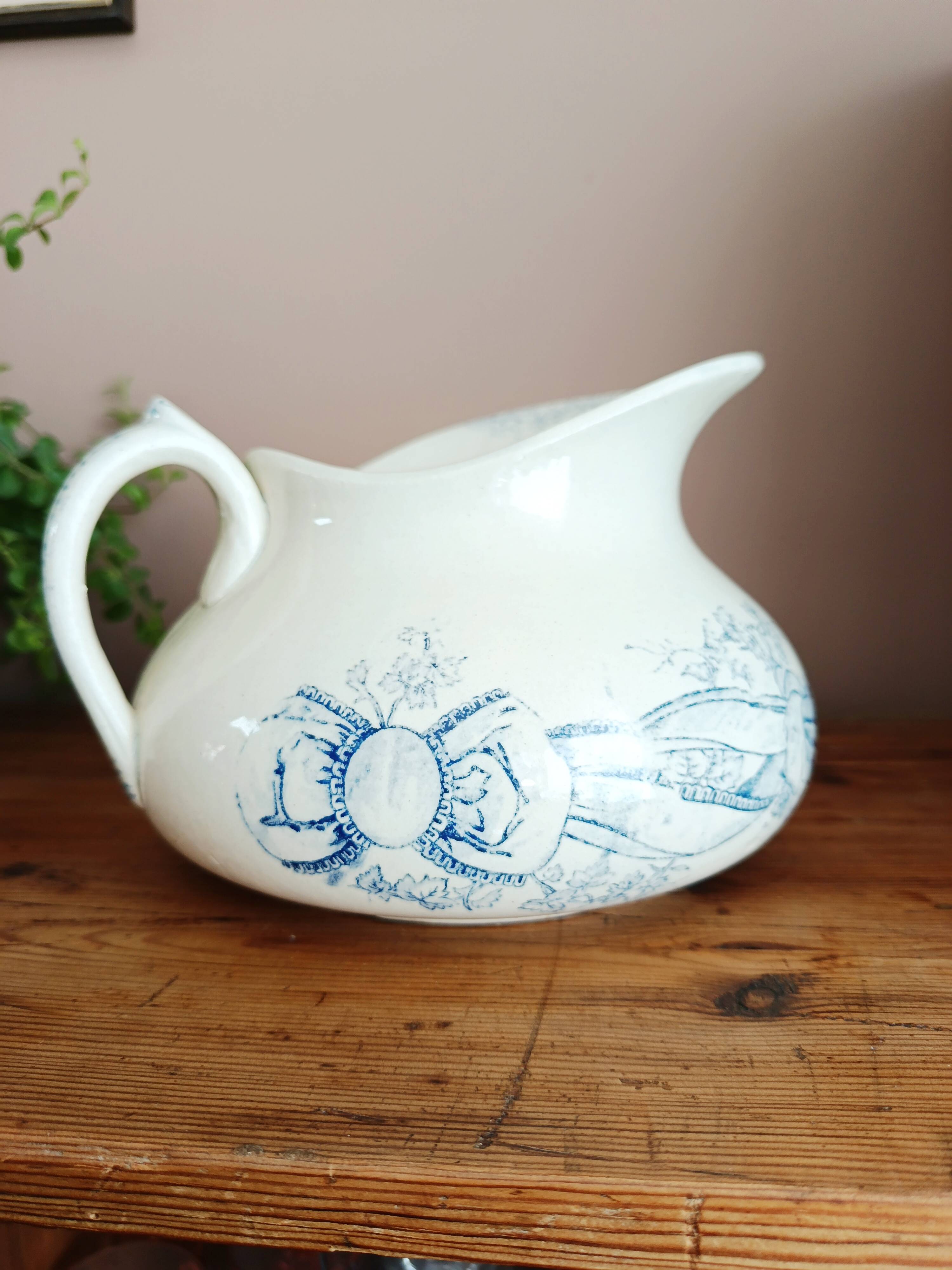 Old bulbous jug in ironstone earthenware