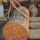 Vintage brown wicker cylindrical basket from the 1940s — long case for a bottle