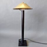 Post-Modern lamp in black metal and gilded brass.