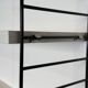 Vintage Nisse Strinning wall rack with 7 white shelves