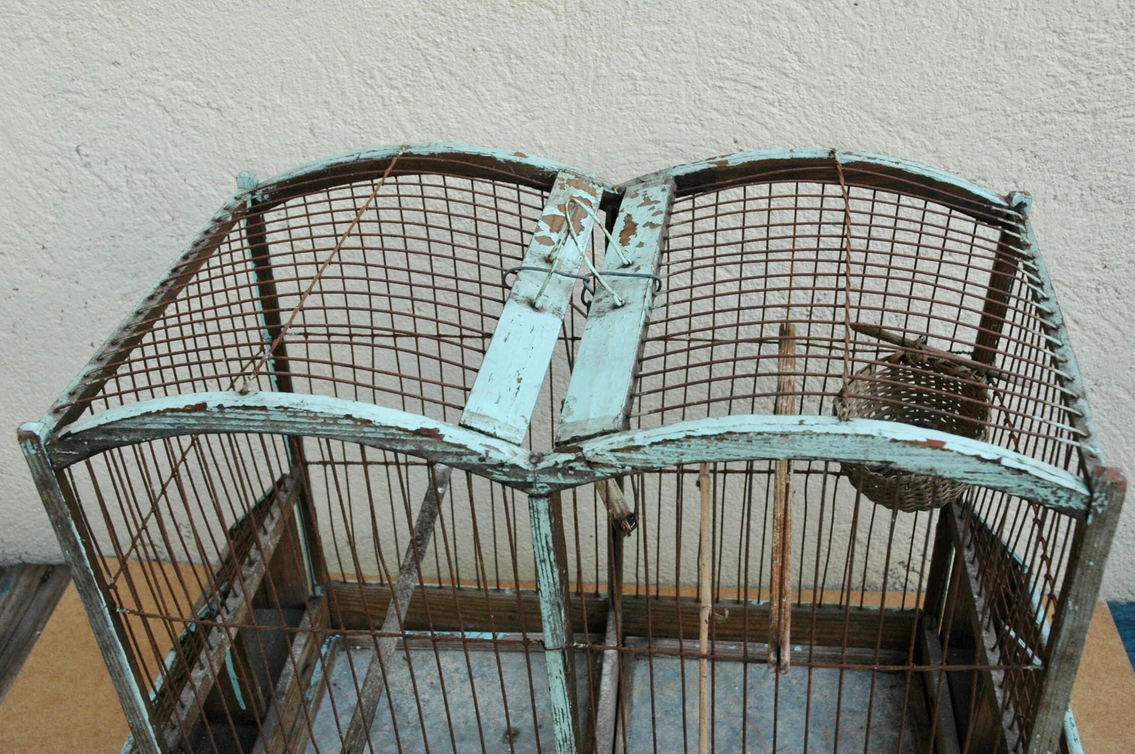Ancient bird cage in wood and metal