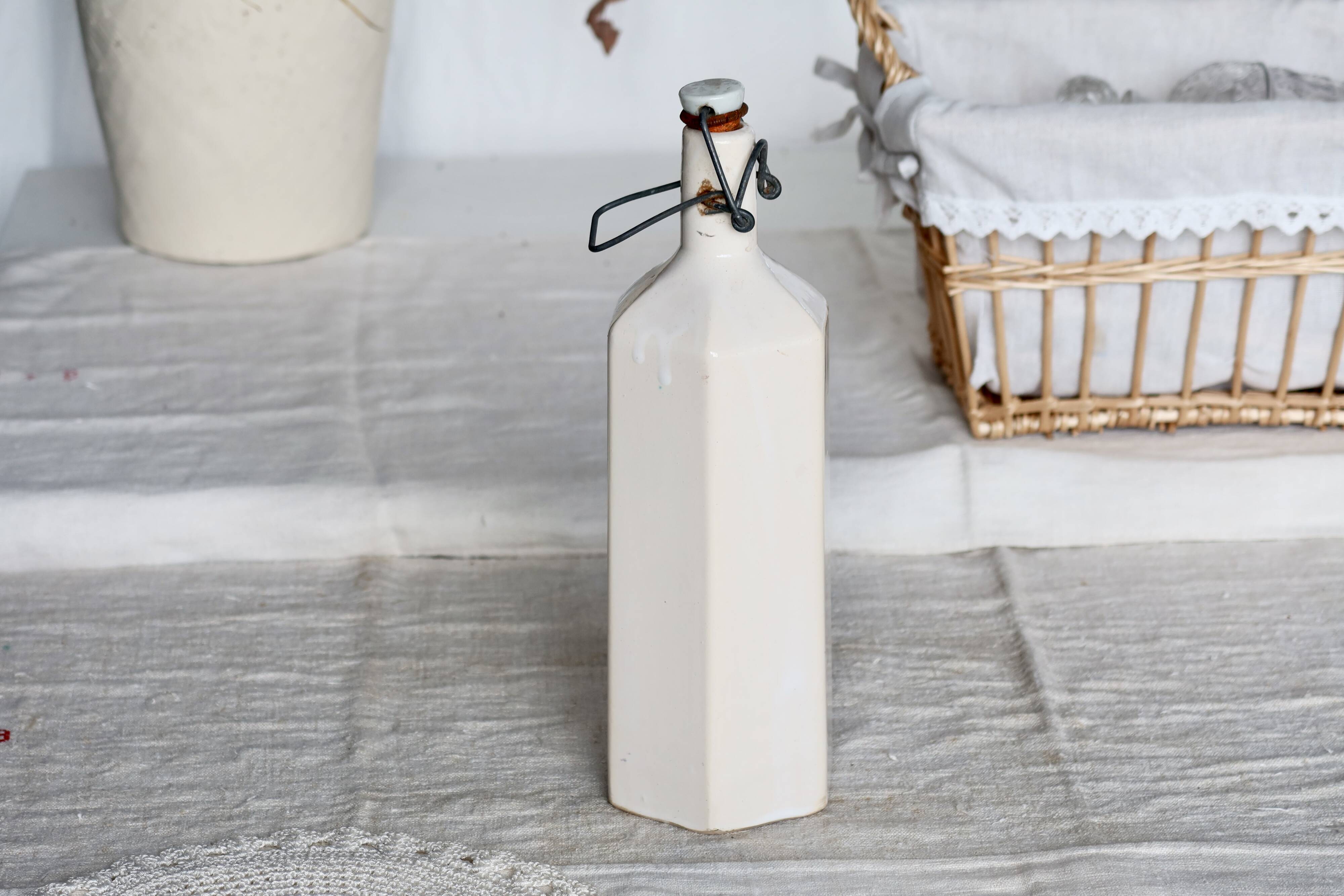 Antique beige glazed ceramic bottle