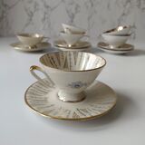 Set of mismatched fine porcelain cups signed with saucer