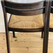 Pair of straw-seated wooden chairs in the regain style.
