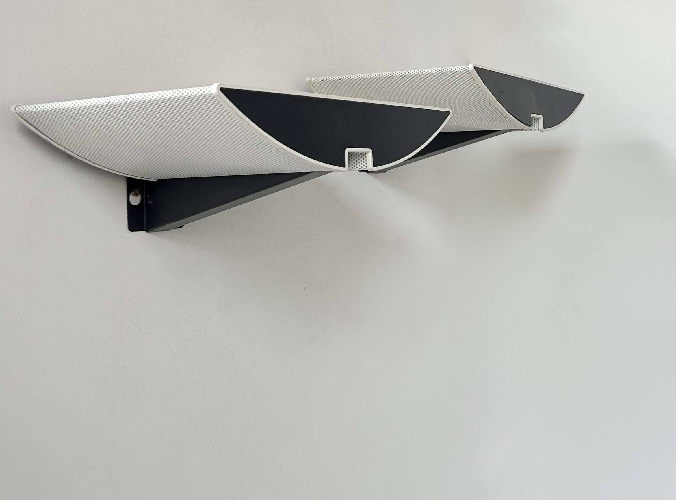 Pair of modernist wall lights, black and white lacquered metal, Italy 1980