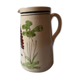 A pitcher in earthenware with a country décor