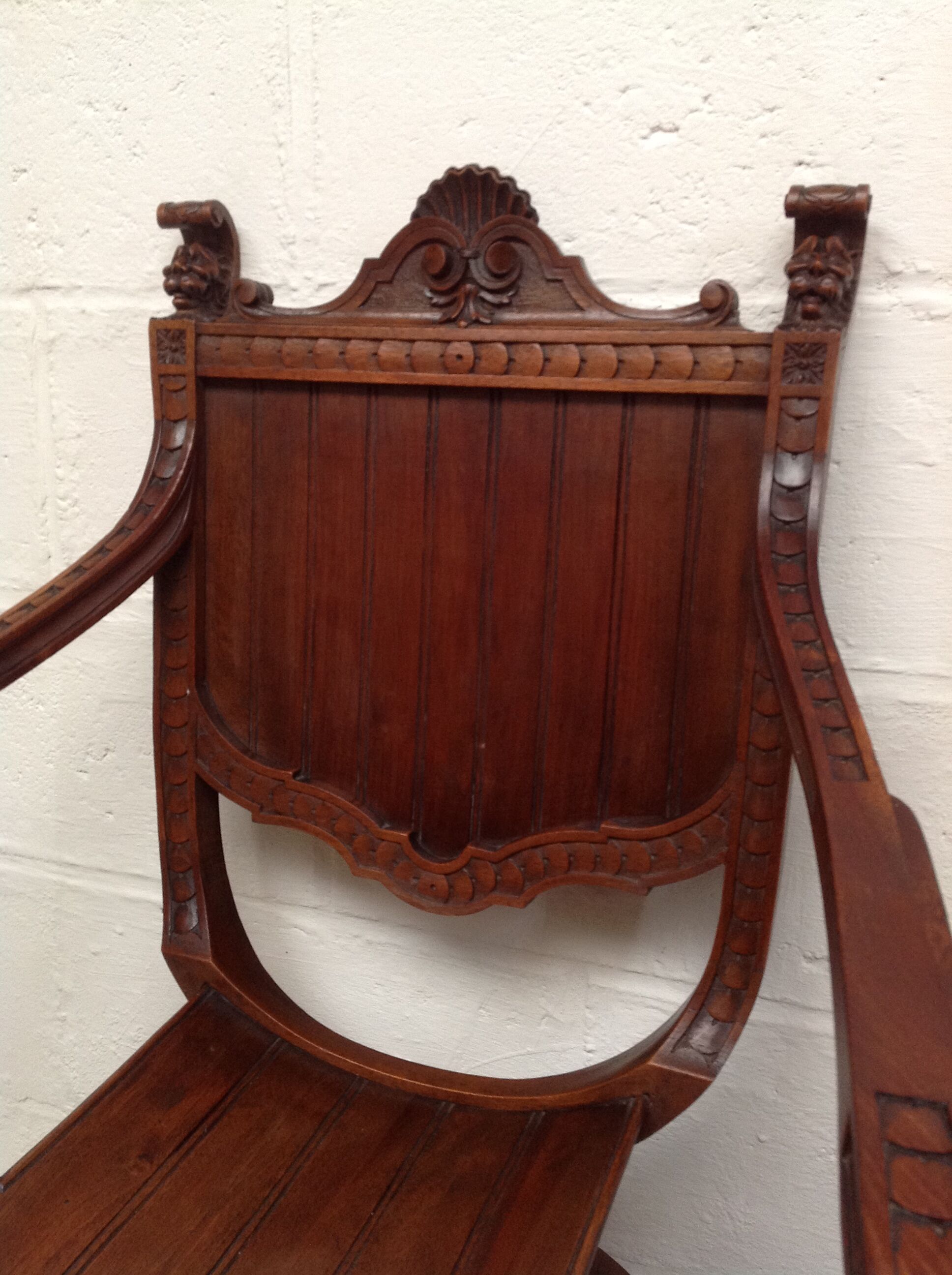 Pair of antique armchairs curules called Dagobert in carved wood