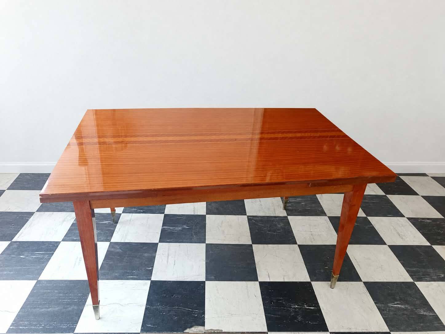 Mid-century vintage coffee table with tapered legs.