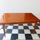 Mid-century vintage coffee table with tapered legs.