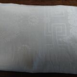 Table napkins set of eleven in a single piece damask linen and silk early 20th century.