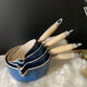 Series of cast iron pans Le Creuset bleues