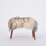 Danish Mid-century Modern stool reupholstered in white and black sheep skin