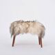 Danish Mid-century Modern stool reupholstered in white and black sheep skin