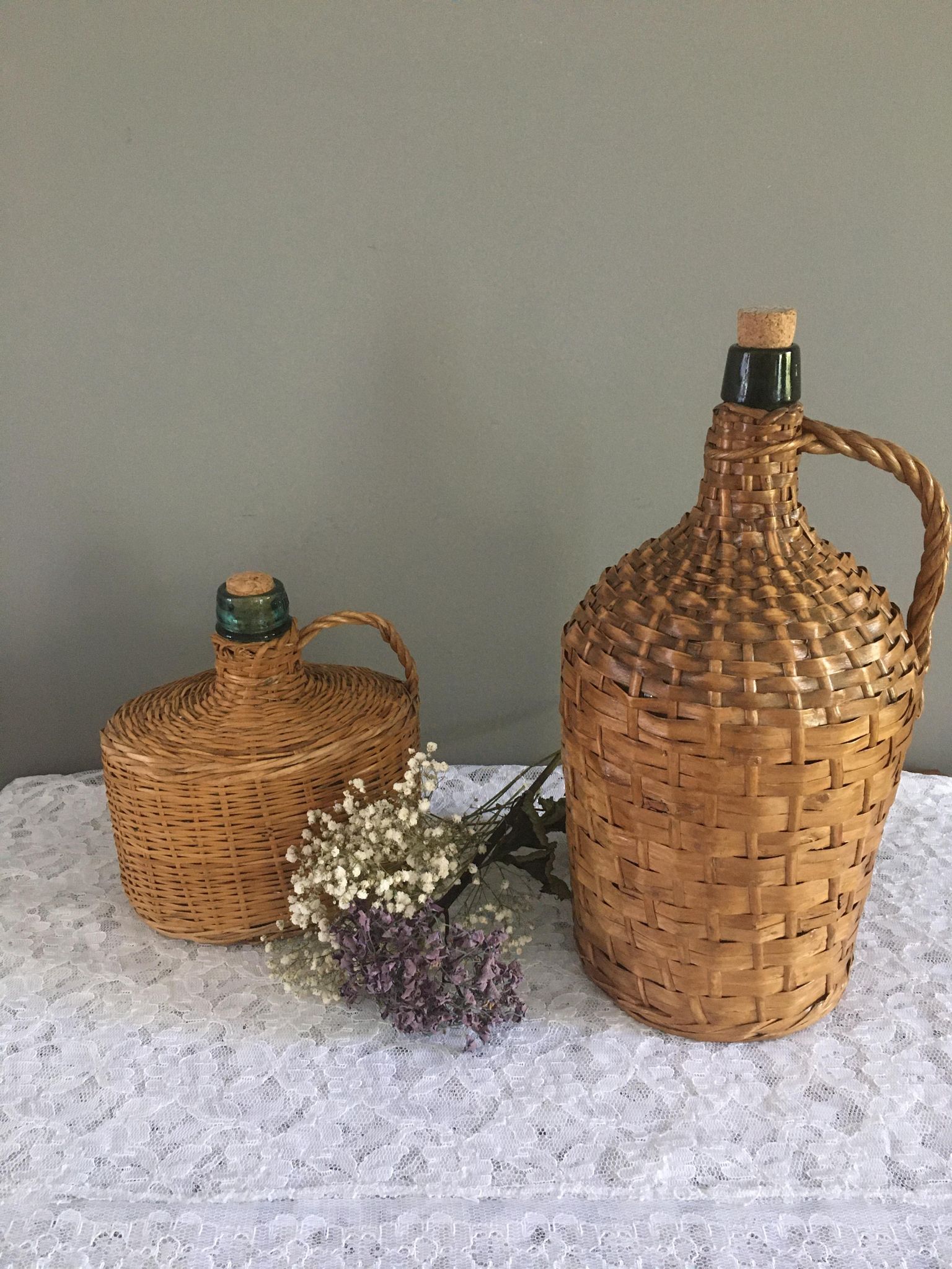 Vintage Dame-Jeanne duo and their rattan/wicker dresses