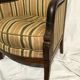 Fauteuil bergère aux dauphins époque Restauration