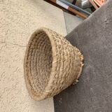 Brown woven wicker basket for collecting eggs — France, 1940s