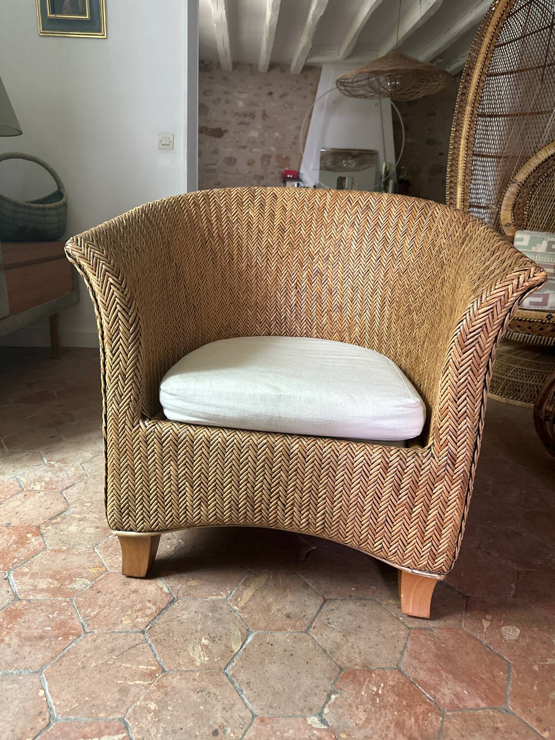 Varnished rattan armchair
