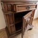 Antique Louis XIII bonnetière in carved solid wood.
