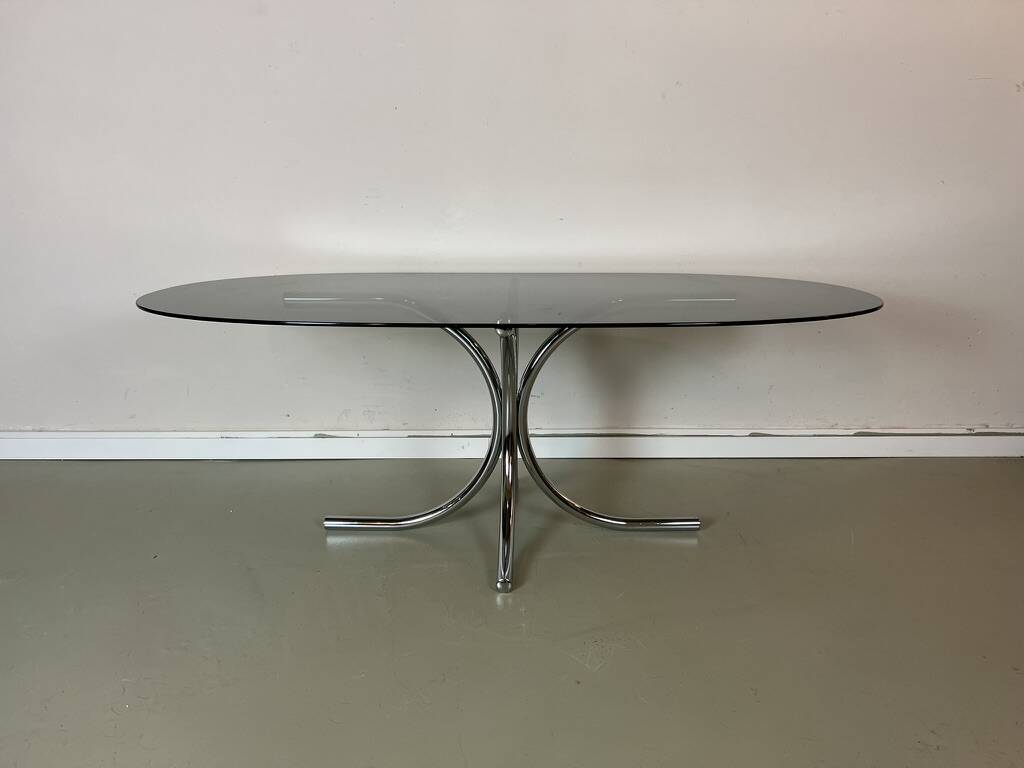 Vintage coffee table from the 70s in smoked glass and chrome, oval, Space Age style.