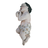 Child on the polychrome plaster cross