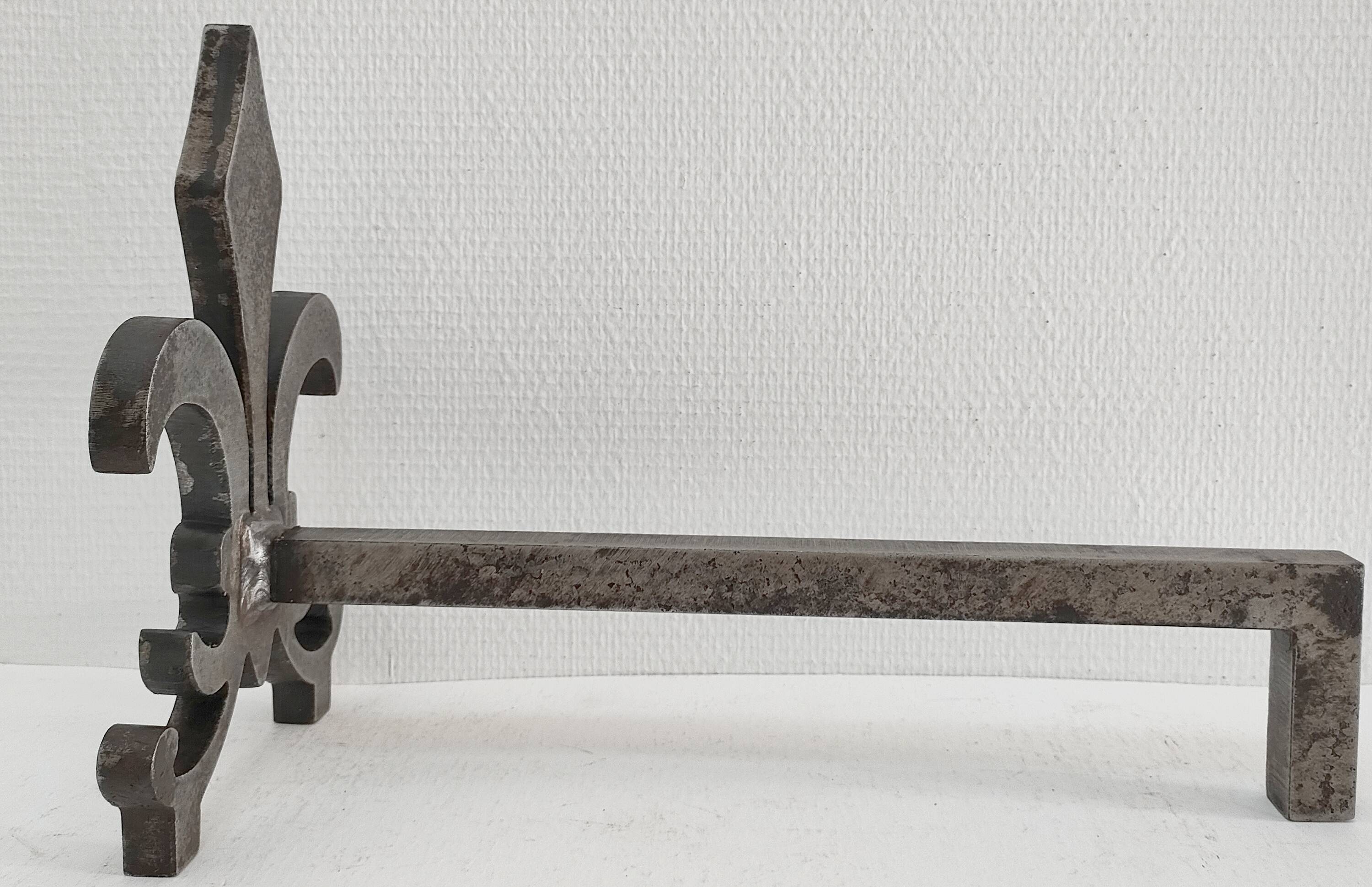 Pair of vintage steel fleur-de-lys andirons