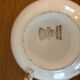 2 porcelain teacups and under teacups floral motifs