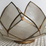 Candlestick or candle holder in nacre flower shape