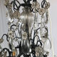 Black lacquered metal chandelier and crystal tassels