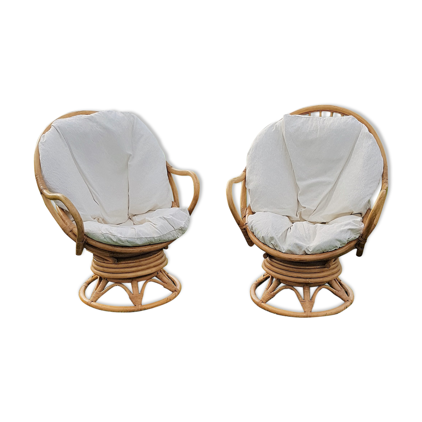 Pair of swivel rattan armchairs