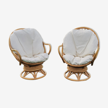 Pair of swivel rattan armchairs