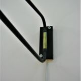 Roger Mathieu's diabolo sconce for Lunel with double lighting