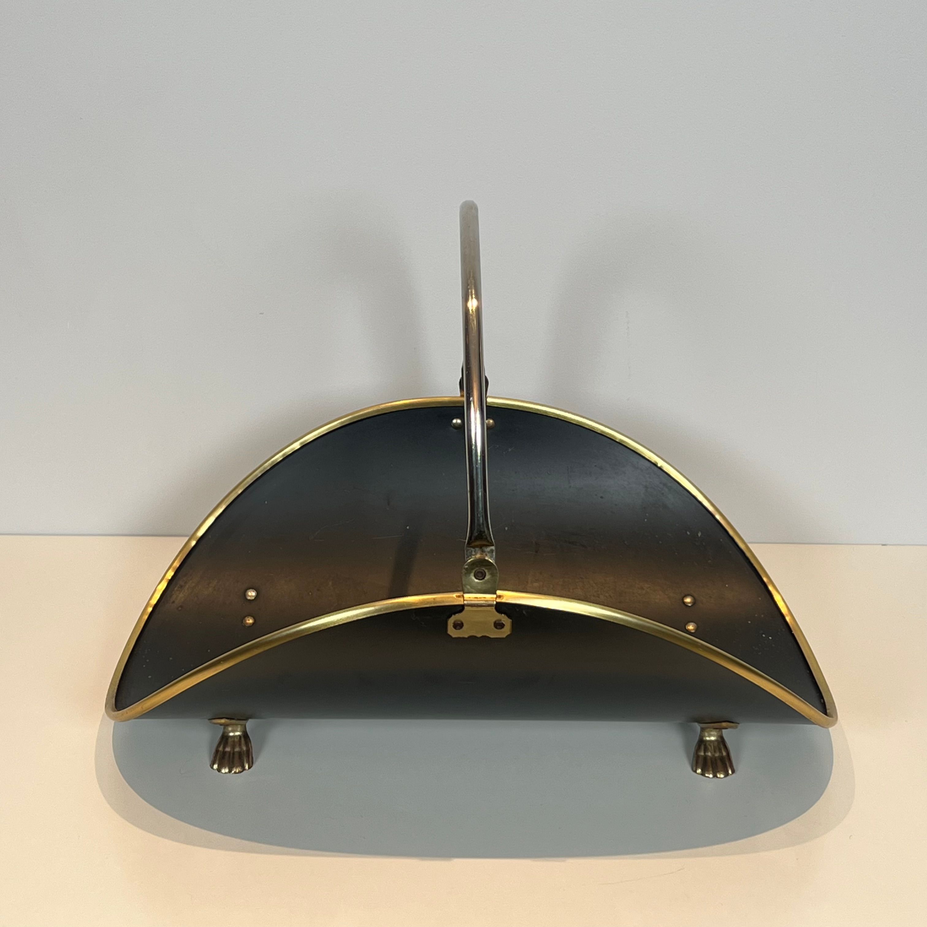 Neoclassical log holder in brass and black lacquered brass