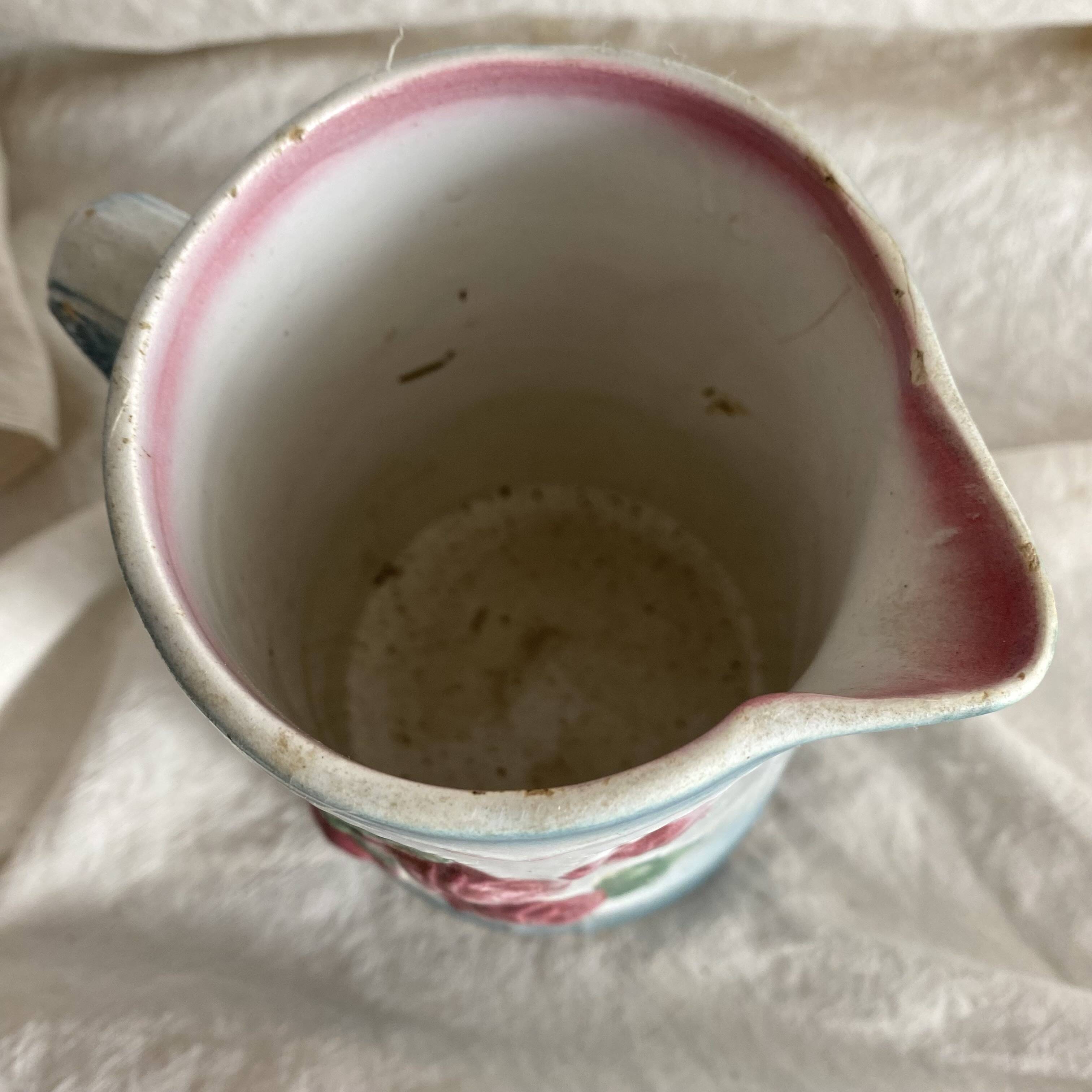 Art Nouveau slip pitcher with roses