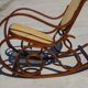 Vintage wooden rocking chair with caning