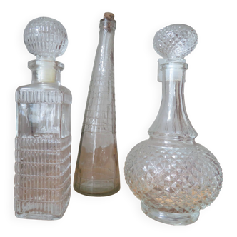 Set of carafes and white glass bottle