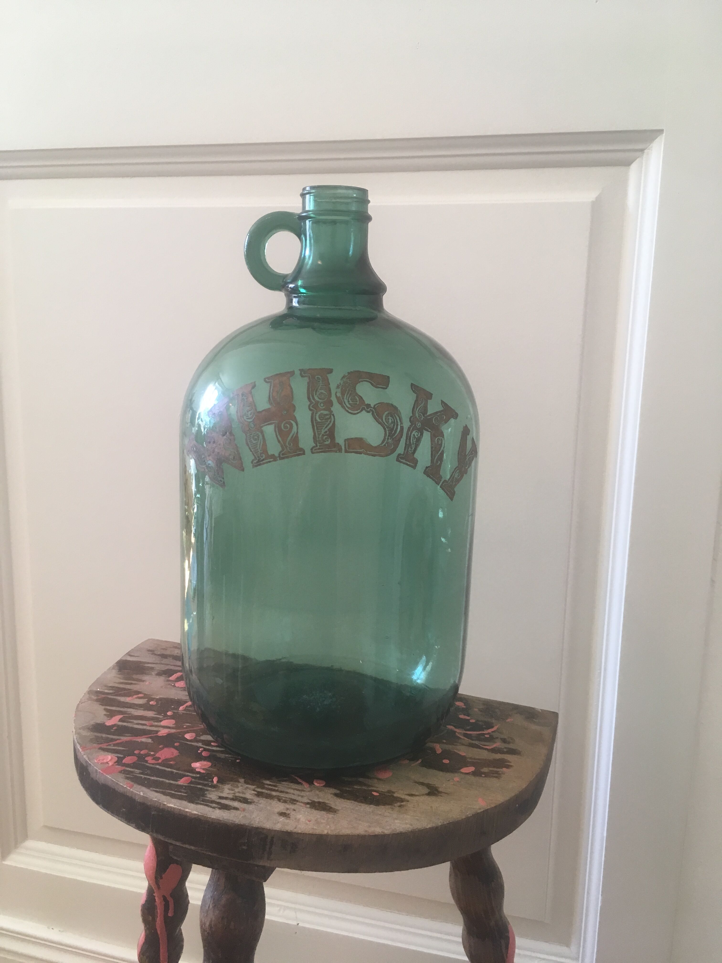 Green glass whiskey bottle