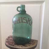 Green glass whiskey bottle