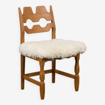 Oak Razor Blade chair in natural sheepskin by Henning Kjaernulf