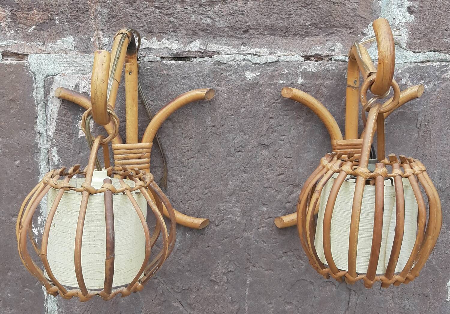Pair of Louis Sognot rattan wall lights.