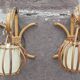 Pair of Louis Sognot rattan wall lights.